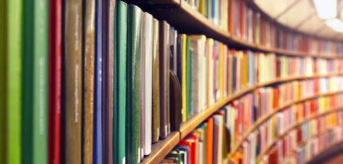 image of a bookshelf of library books to depict audiobooks libraries