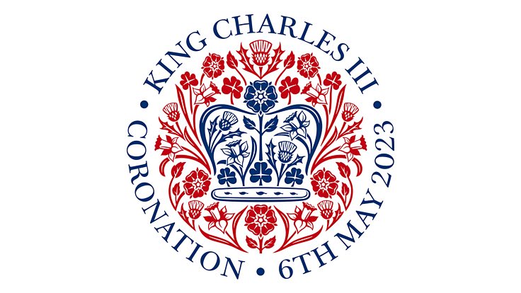 Image of the logo to mark the Coronation of King Charles III on 6th May 2023. The logo features a crown in navy blue surrounded by a ring of red flowers